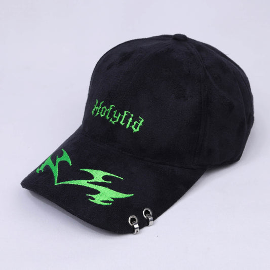 Black cap with green embroidery on a light gray background